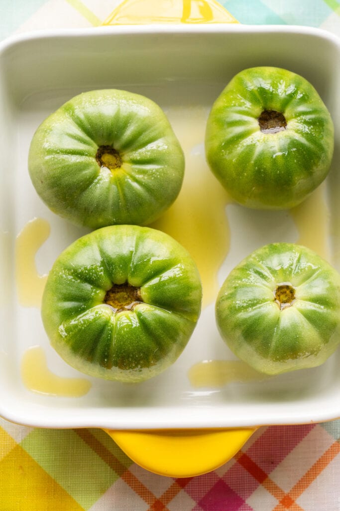 olive oil and salt on green tomatoes.