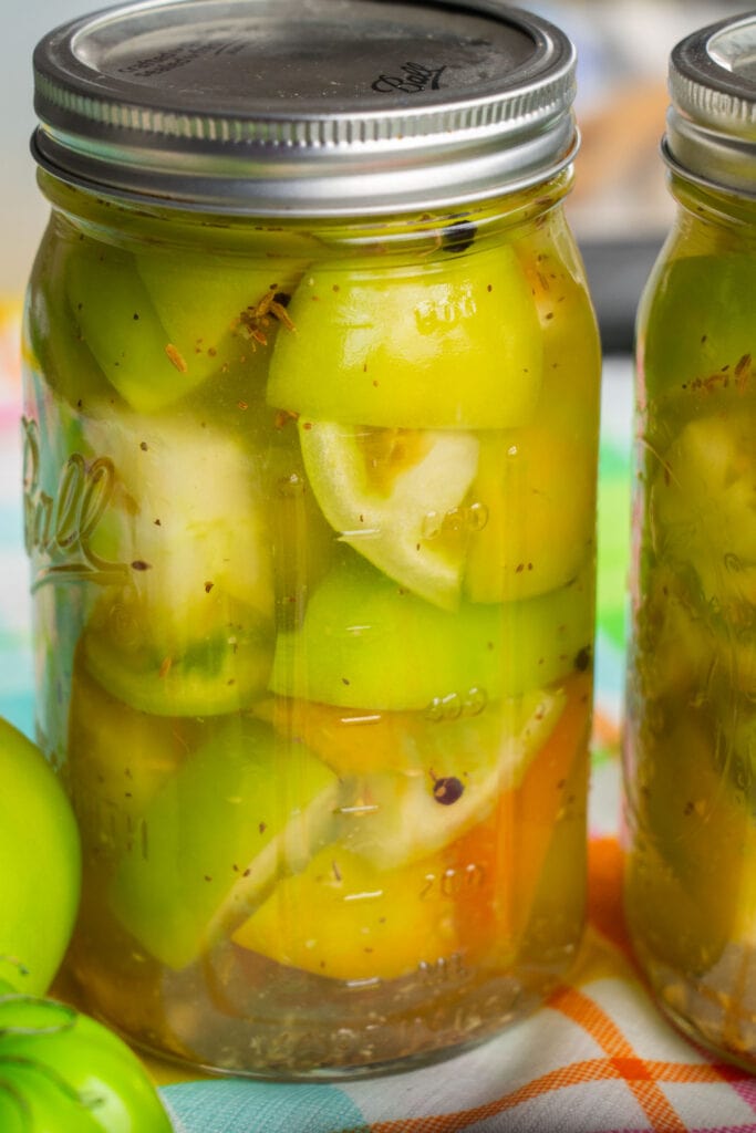 mason jar filled with pickled green tomatoes.