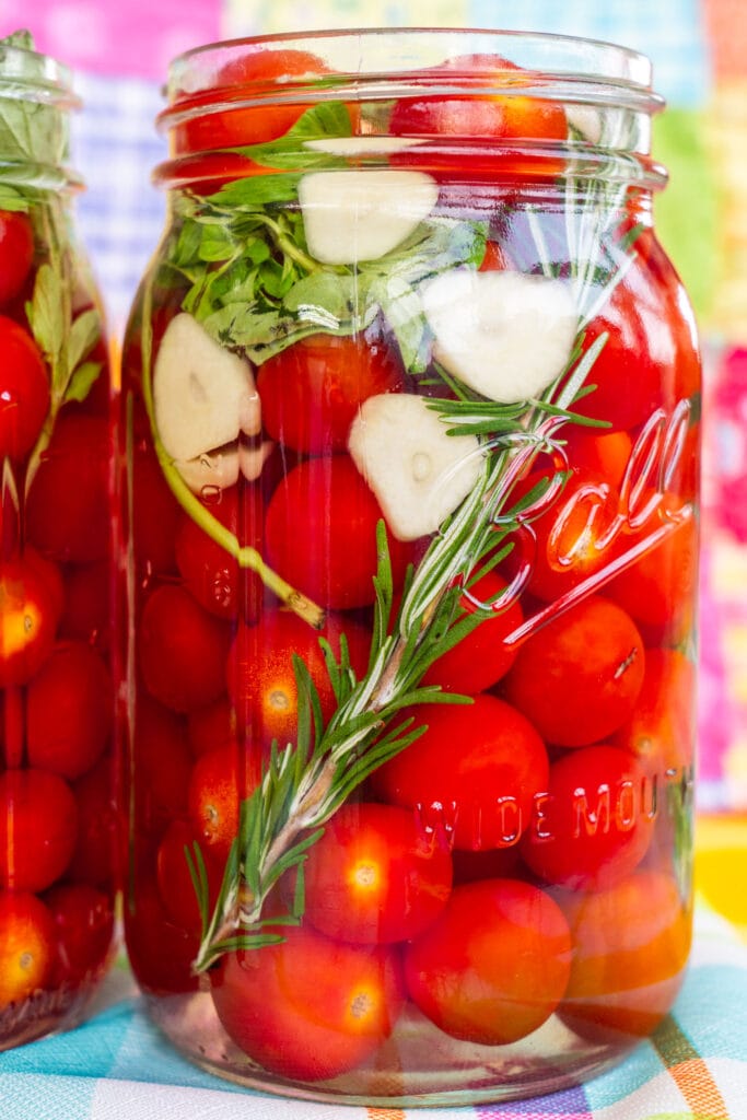 quart mason jar filled with pickled cherry tomatoes