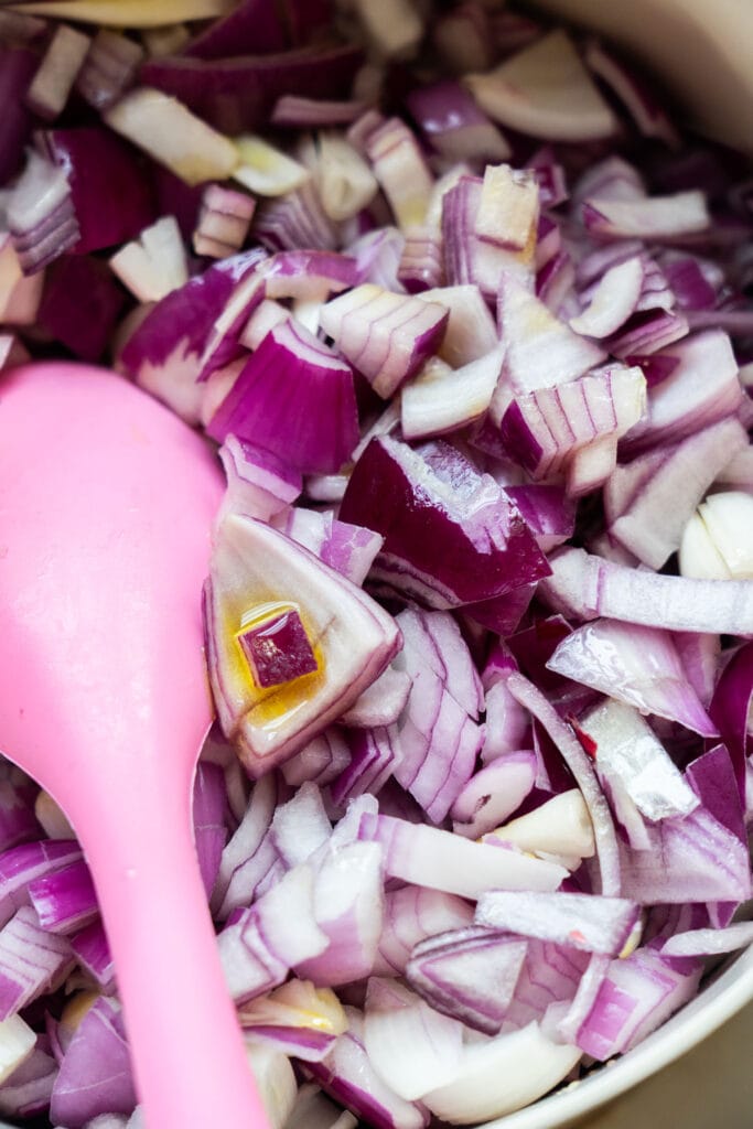 red onions chopped up in pot.