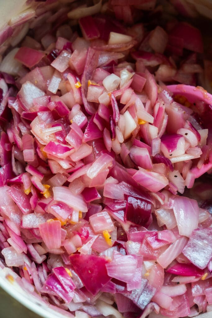 red onions and olive oil softened in pot.