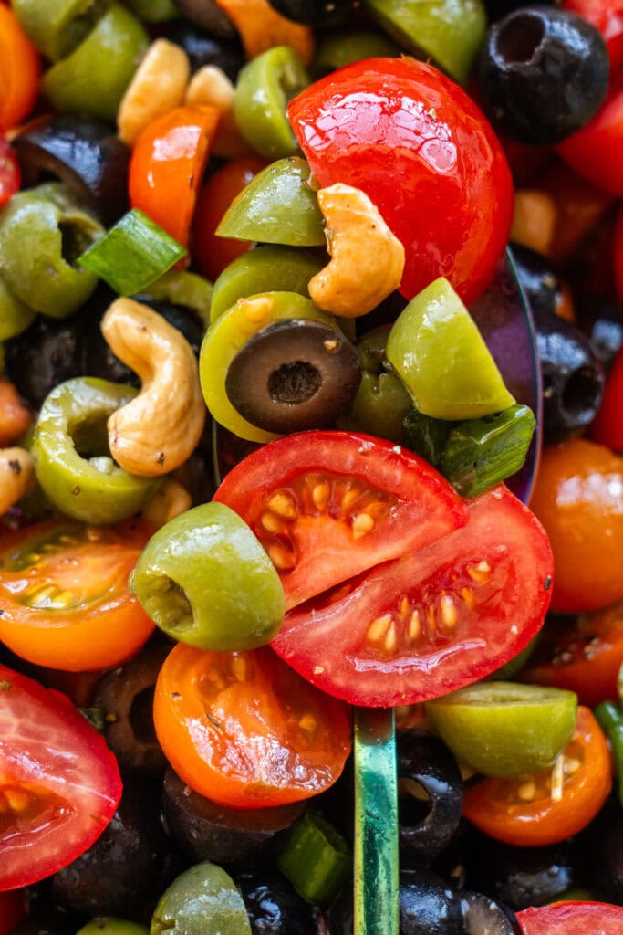 closeup of cherry tomato and olive salad.