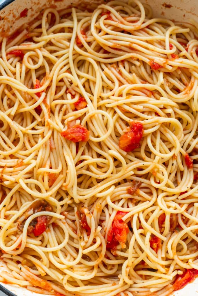 spaghetti tossed with tomatoes.