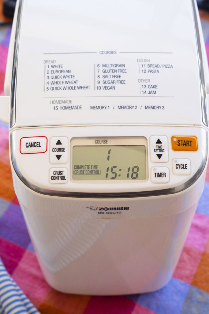 bread machine on table with white bread option chosen.