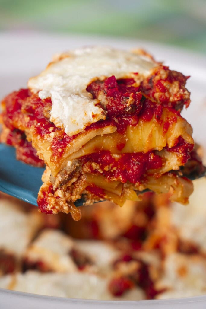 a slice of lasagna coming out of the crockpot. 