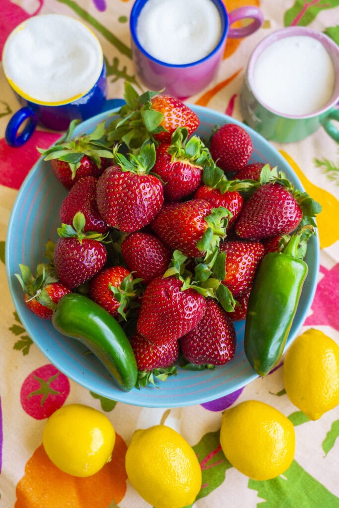 strawberries and jalapeno in bowl. 