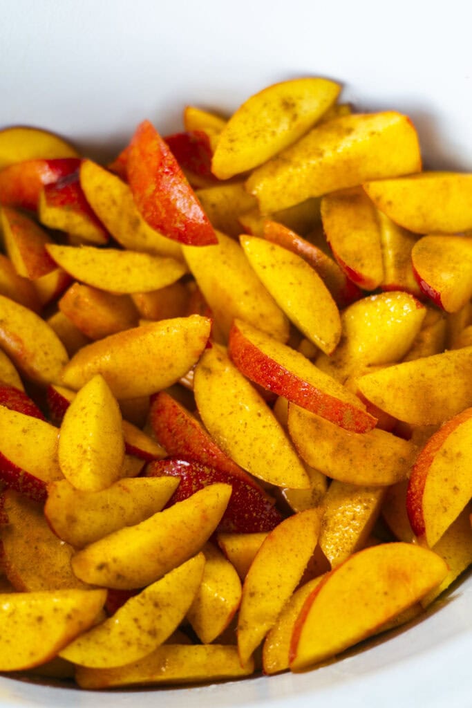 cinnamon sprinkled on top of peaches.