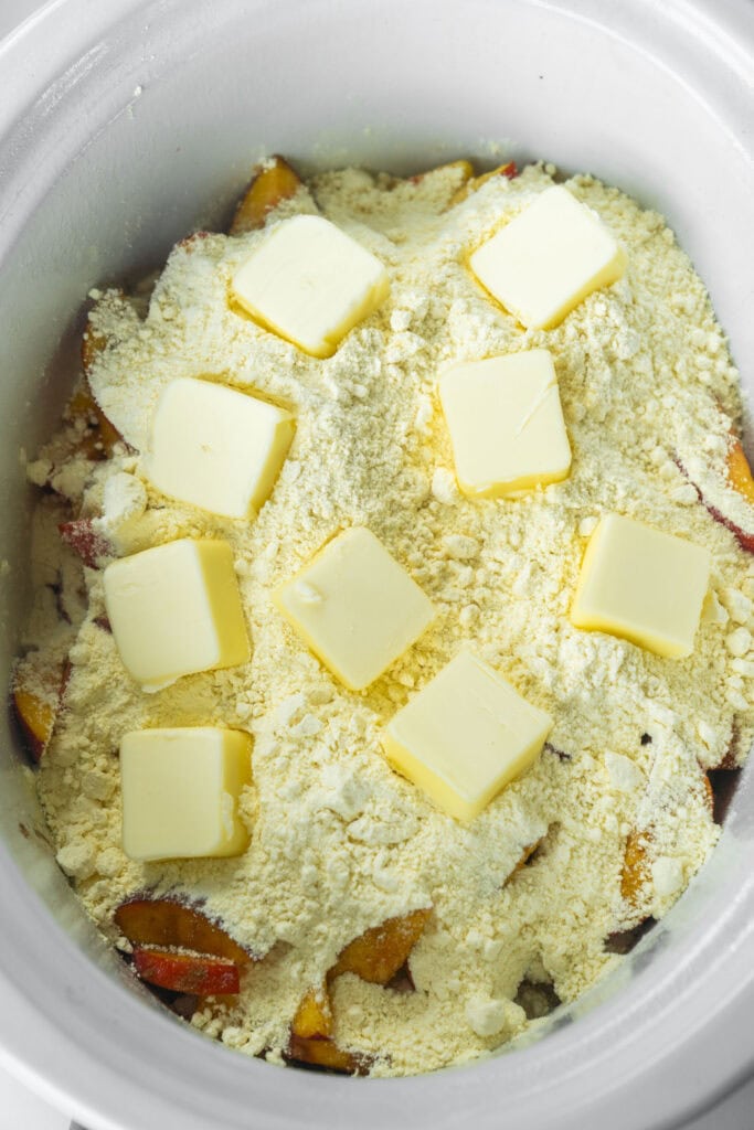 8 pats of butter on top of cake mix.