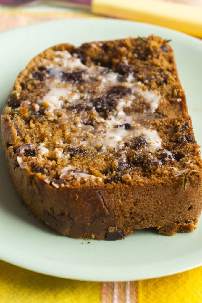 slice of cucumber bread with melted butter on top.