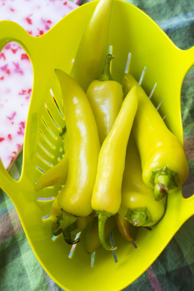 basket filled with banana peppers.