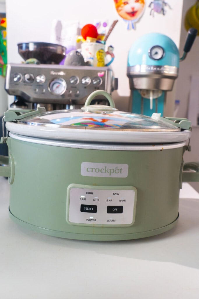 green crockpot sitting on counter. 