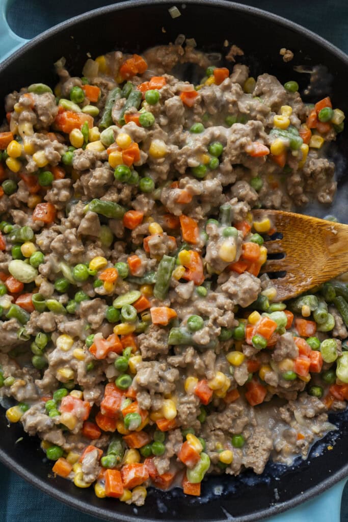 creamy ground turkey and mixed vegetables in skillet.